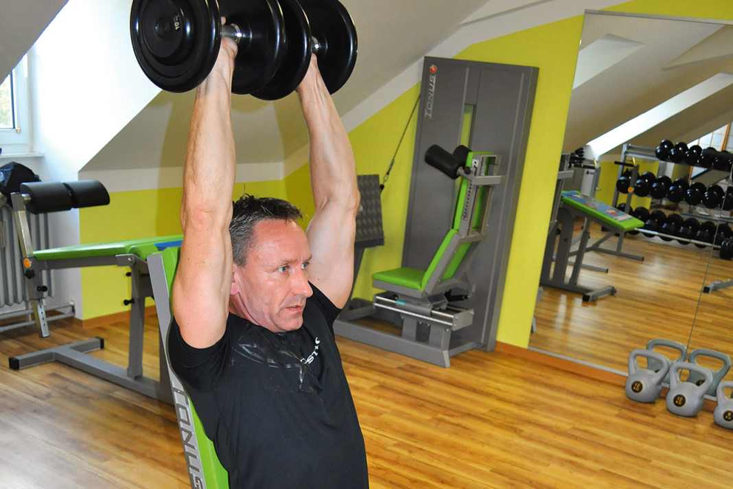 Neck press: Hold the dumbbells vertically above your head with your arms straight. Then slowly lower them sideways as far as you can ...