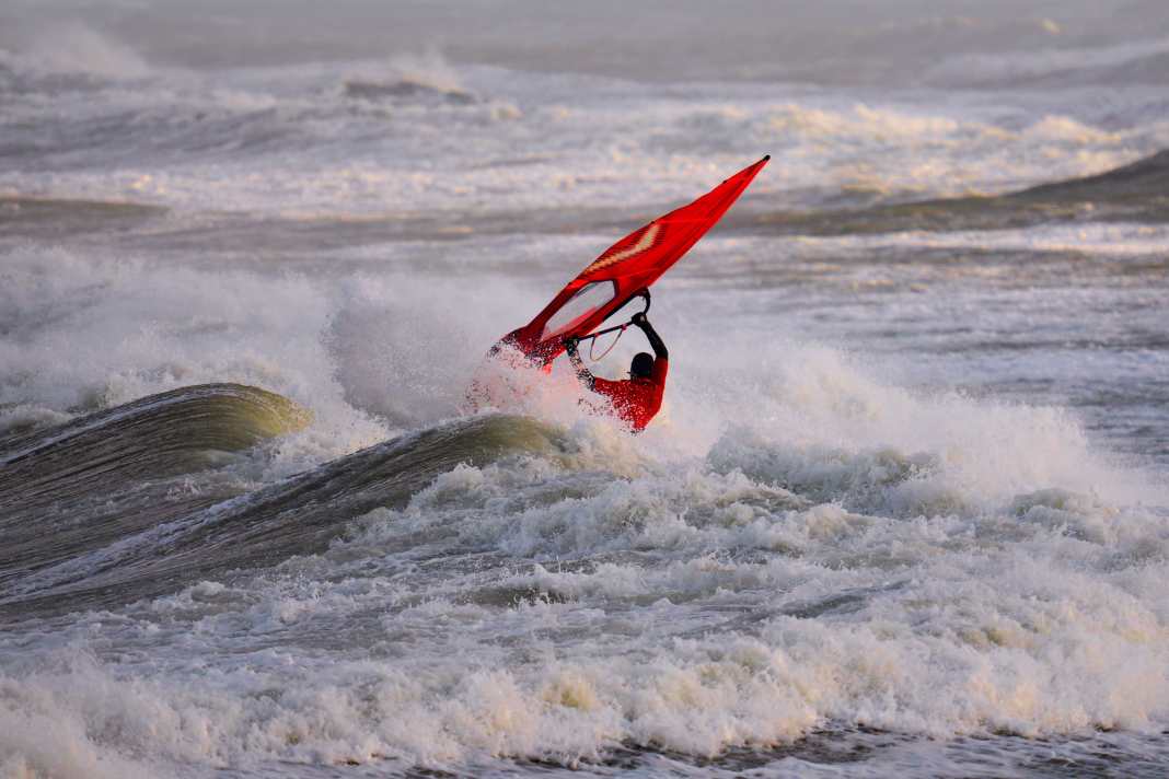 Christian Kohl takes on a North Sea breaker in the morning light