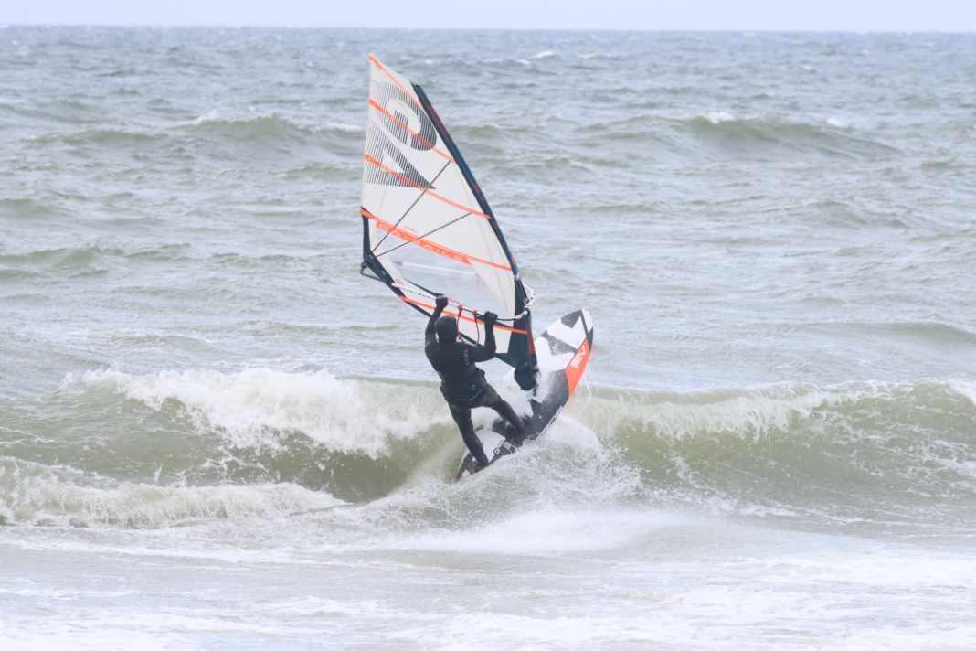 The high five: The breaking wave lip hits the board from the underside
