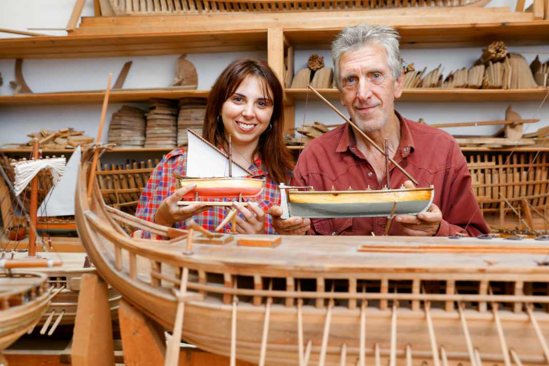 Daughter Rigina and father Yannis Boudalas with small models that they offer as souvenirs