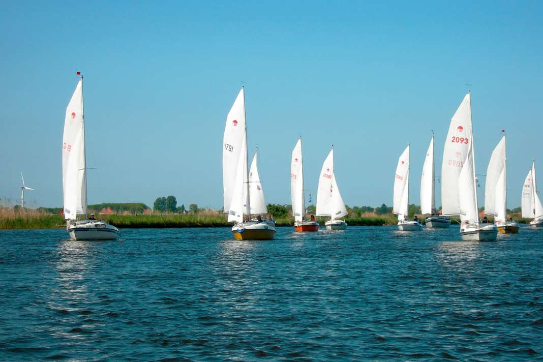 Fam flotilla on the Frisian canals. The sheltered inland area is ideal for small dinghy cruisers