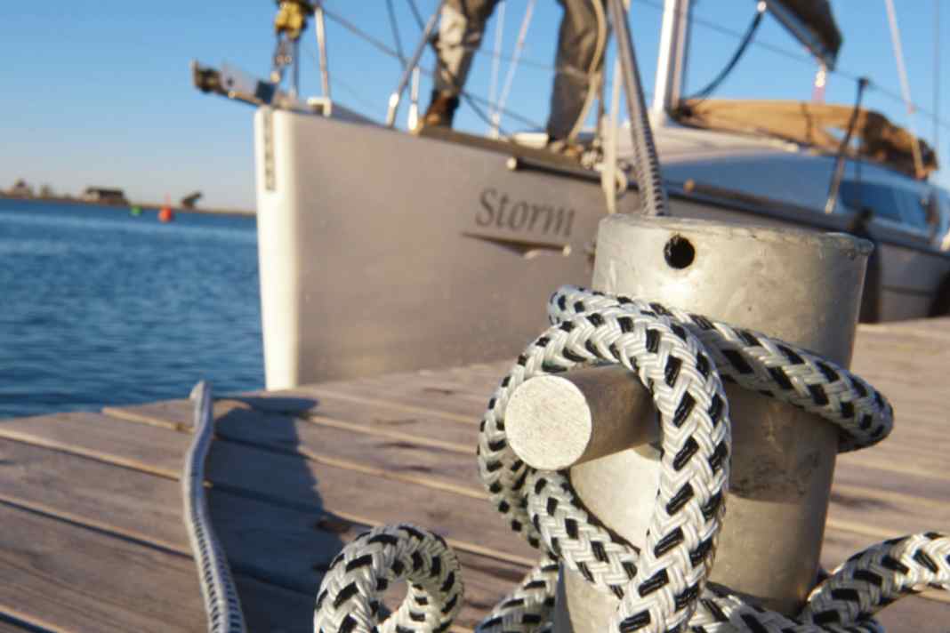 Mooring lines in use. The eyes of most prefabricated lines are designed for the cleats on board. They are too small to be placed over a bollard