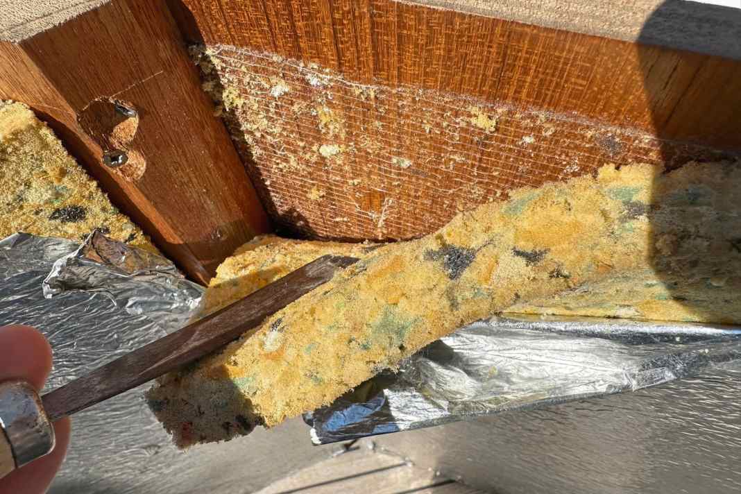 The old insulation must be completely removed. The foam board comes off easily, a pry bar helps. However, the adhesive remains on the substrate.