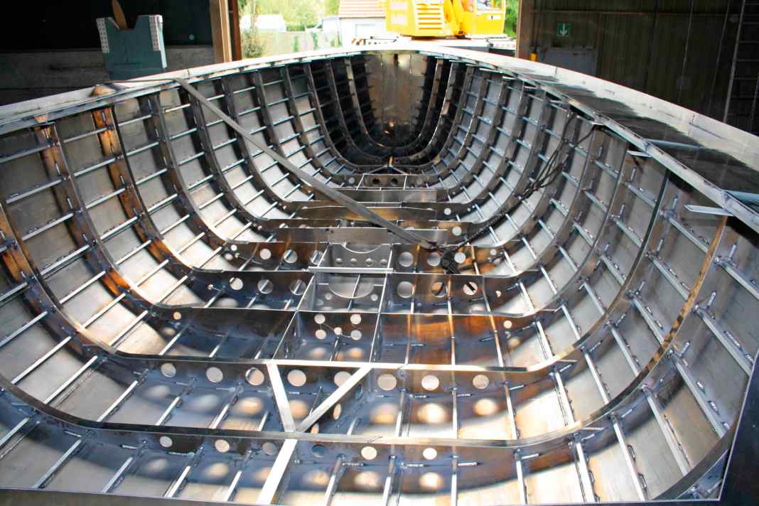 An aluminium boat is created from a frame and stringer skeleton, ...