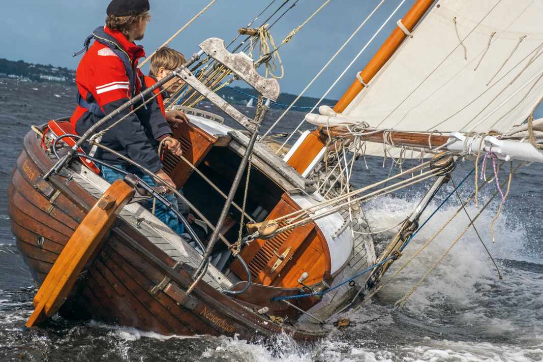 Autumn on the Flensburg Fjord. Owner David Friedrich routinely at the tiller of his "Timpe Te".