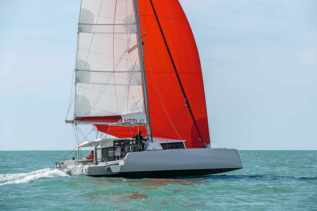 Up the leg. The tri always sails downwind with a slight heel. Upwind, the swimmer dives out.
