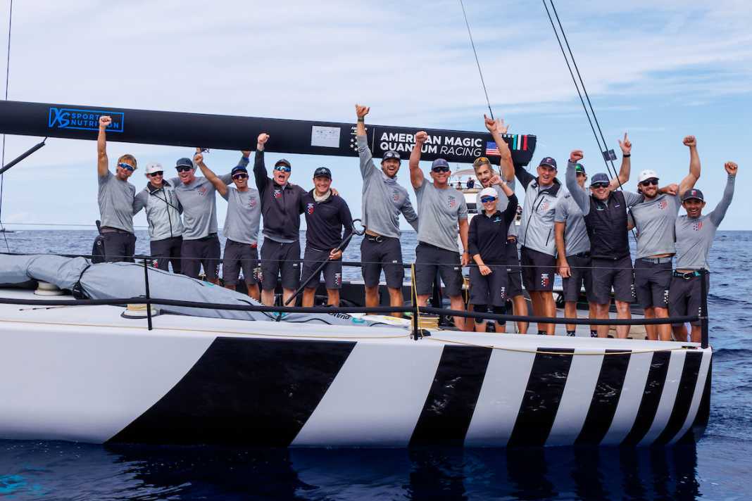 Cheering and waving goodbye: the crew of American Magic Quantum Racing do both at the same time.