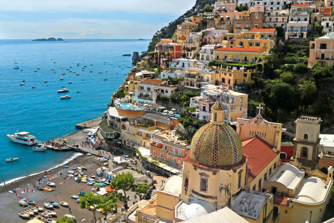 View of the town of Positano. Yachts can moor in front of it at mooring buoys