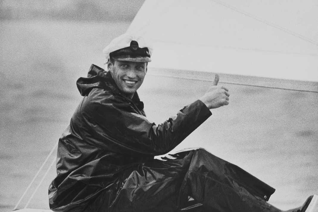 Crown Prince Harald happily on board. In oilskin with KNS cap, year unknown.