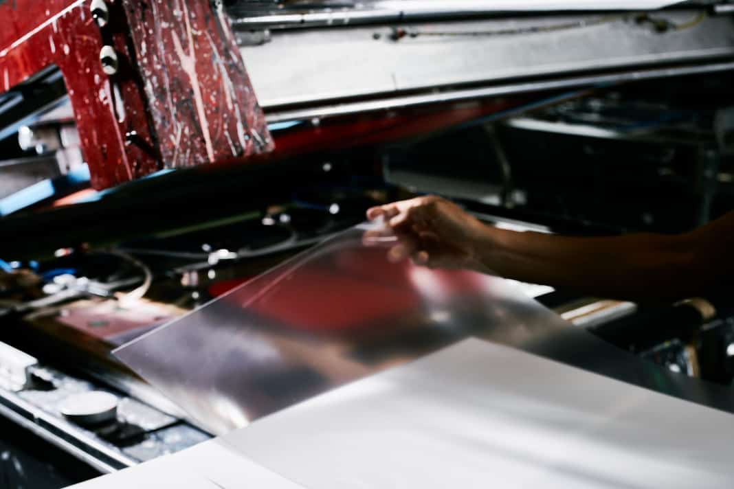 The production process starts with a film blank. This is placed in a press by hand