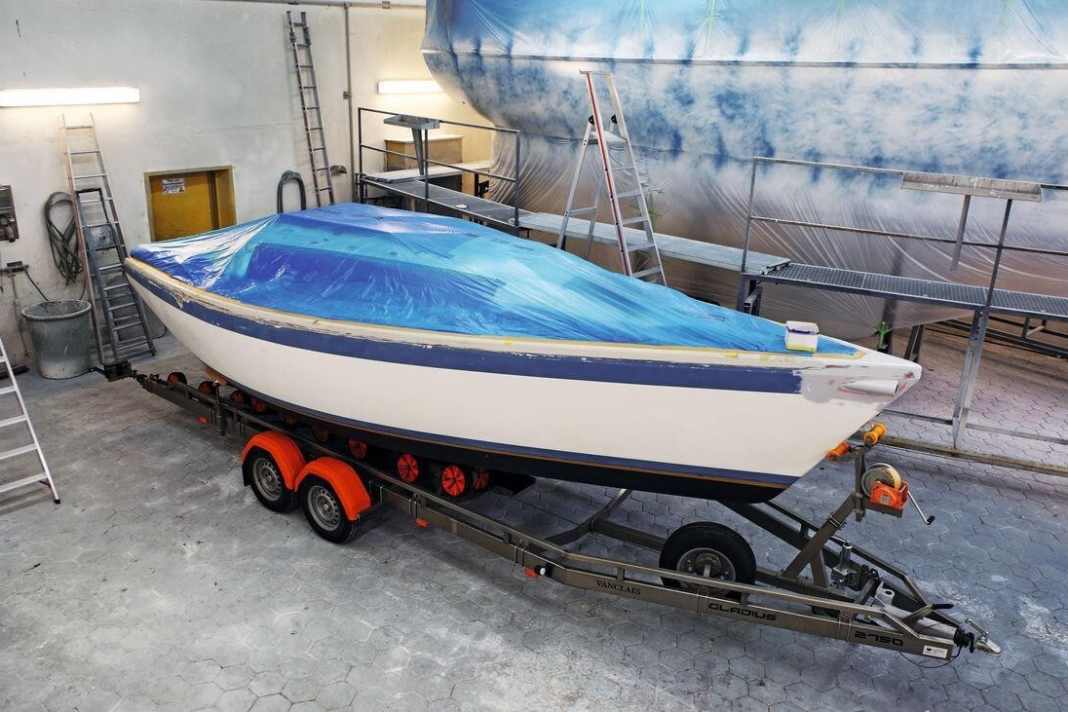 The deck, which is not to be painted until the end, is masked off. The underwater hull is also protected