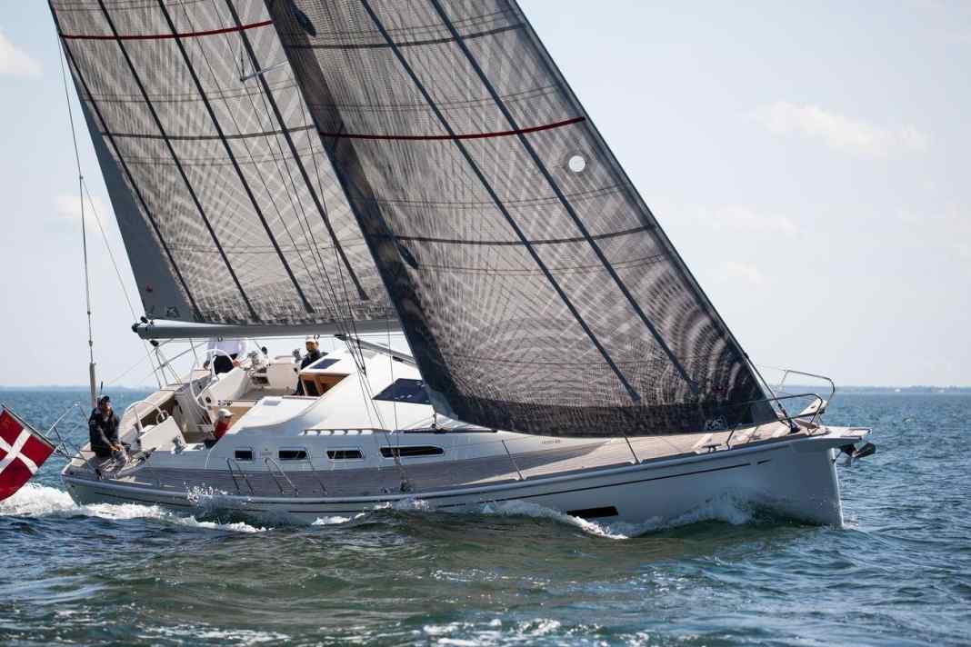 Good perspective. The Faurby looks elegant in position and from leeward. The sheer deck is striking, even the centreboard adjustment is concealed aft