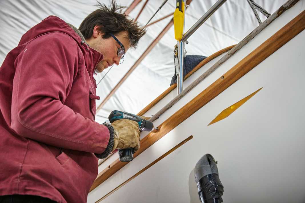 The wooden moulding is glued and screwed in place so that it can withstand rough bumps, which also makes it easier to install