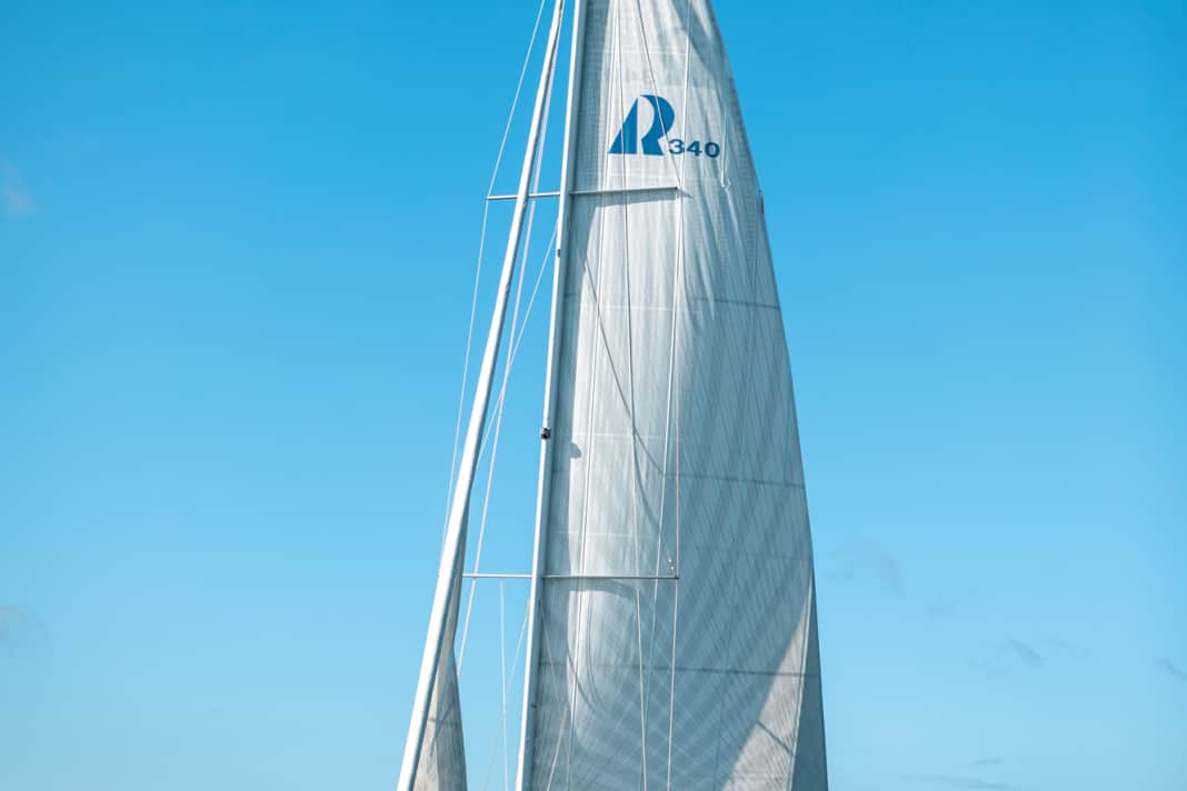 Before furling out, drop to a deep room sheet course. This reduces the apparent wind on deck. Loosen the genoa halyard slightly and do not drive the backstay too tightly. This reduces the load on the bearings of the furling system and less force is required