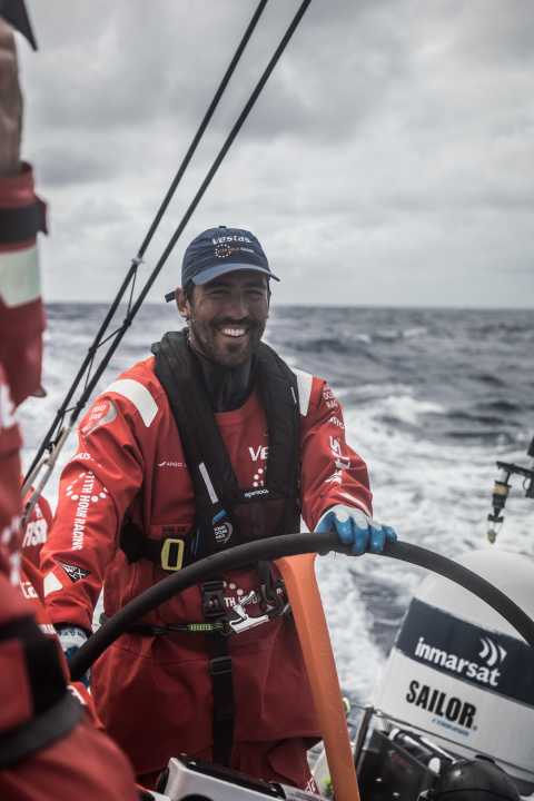   Enjoying the race to catch up: Mark Towill at the wheel for the Vestas 11th Hour Racing team