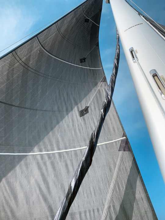 The rolled-up Code Zero is set upwind from the genoa