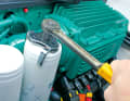 Unscrew the oil filter using the filter claw or filter bell. Lubricate the sealing surface before fitting the new filter.