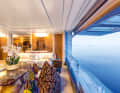 Ethno look: The large saloon on the main deck presents the furnishing style of this exceptional concept. The wall of the superstructure, which can be opened upwards together with the glazing, has never before been repeated in a design of this format