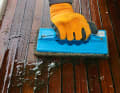 Step 5 - Sanding: Cleaning pads are used to treat the entire surface of the deck. Unlike scrubbing brushes, they do not penetrate deeply