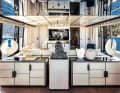 Skylounge: Three sliding glass doors open from the airy saloon on the upper deck. One to each of the side gangways and one to the aft cockpit