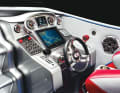 The steering position is clearly structured and has two lever racing controls, two rev counters and a trim indicator.