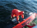 The crew of the "Werner Kuntze" right the capsized dinghy