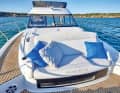 Up to three people can sunbathe on the foredeck. The front cushion can be folded up to form a bench seat