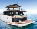 Wide throughout: hull hatches extend the almost sheer bathing platform. Behind the black front are the tender garage and engine compartments