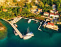 Small harbour at the foot of the mountains. Stari in the north-east of the harbour offers a solid jetty for guest sailors