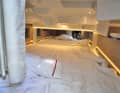 The dimensions of the underfloor berth are 2.02 x 1.80 m