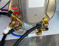 A pressure relief valve, shown here in black, is intended to prevent the boiler from bursting in the event of a fault and also serves as a drain