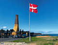 The chimneys of the numerous fish smokehouses are a typical sight