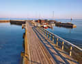 Snogebæk harbour - one of the smallest on Bornholm - is connected to the village and the sandy beach by a wooden pier