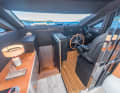 The steering position and companionway are located at the front.