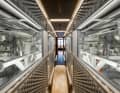 The massage room is followed by a corridor that leads through the glass engine room to the guest cabins.