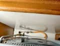 The operating pressure of the cooker must match the system.  A flexible hose is required so that it can oscillate freely.