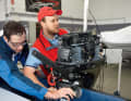 Before going out on the water for the test runs, each engine is attached, secured and tuned.