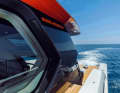 Beautiful fascia:  The roof moulding conceals the minimalist flybridge.  The orange colour makes the SP110 instantly recognisable - no matter which bay it is in