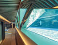 ... which rotates for the perfect view of the glass pool (below right), the sea or the TV and divides into two semi-circular sofas