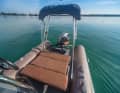 The sun lounger in the stern area, which also provides access to the swim ladder