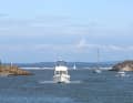 Pleasure craft arriving from the mainland in the sound between Nordkoster and Sydkoster.