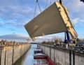 The new lock gate on the crane