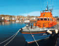 Mooring of the sea rescuers in Lerwick, behind them Victoria Pier.