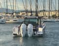 The boat is powered by two Mercury outboards.