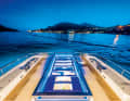 Sunbathing areas line the counter-current pool, which can be illuminated in the evening