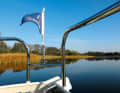 Travelling on mirror-smooth water between Canow and Strasen on the Großer Pälitzsee lake