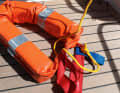 In the right place: It makes sense to place certain life-saving equipment where it is likely to be needed. This rescue collar (shown here ready for use) is normally located in a labelled pocket on the railing of the aft deck