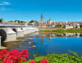 Bridge building: View from the river island across the shallow main branch of the Loire to the historic centre of La Charité-sur-Loire. The fortifications can be seen on the left
