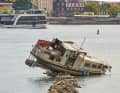 Low water levels are now making salvage more difficult.