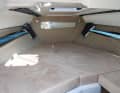 The dimensions of the sleeping area promise space for two. The headroom is due to the design (day cruiser). A toilet is located at the very front on the starboard side